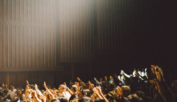 people raising their hands